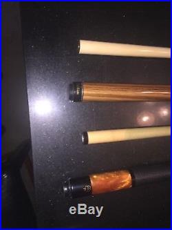 Used Mcdermott pool cue with Action 3 piece jump/break cue andan Action case